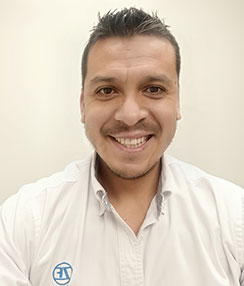 Smiling young man in white polo