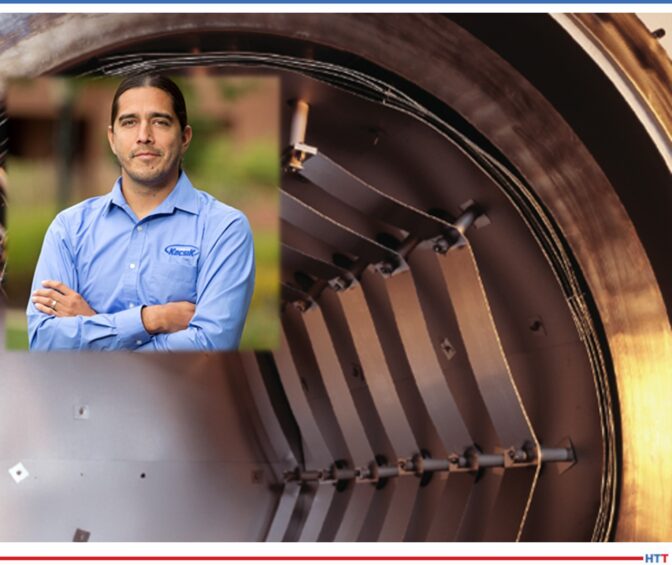 Young man with arms folded with background of furnace interior
