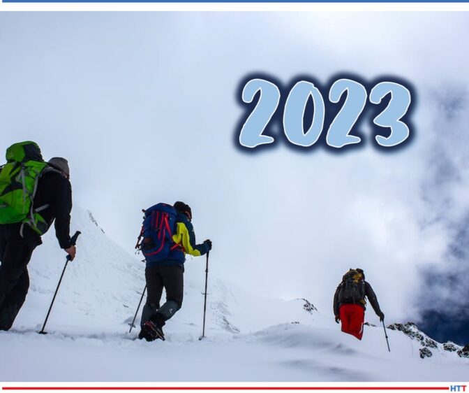 Hikers trekking up a snowy mountain