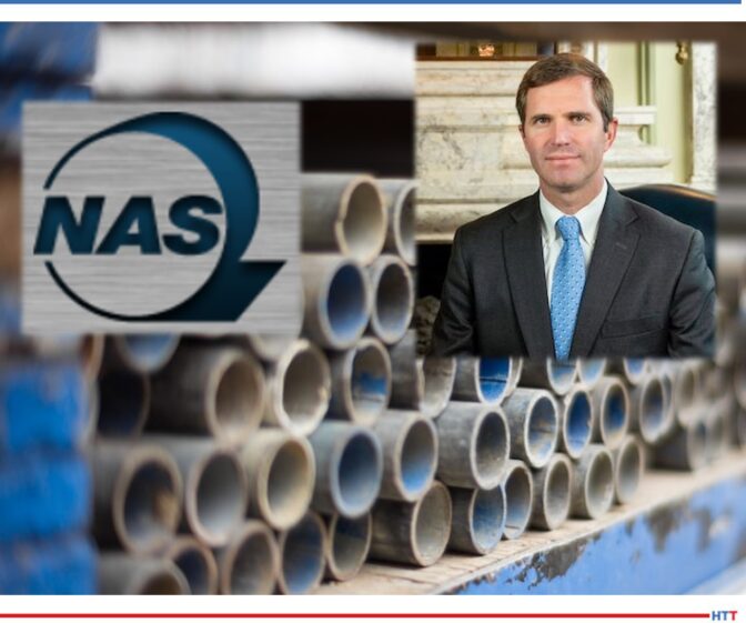 A stack of steel pipes with the NAS logo in forefront