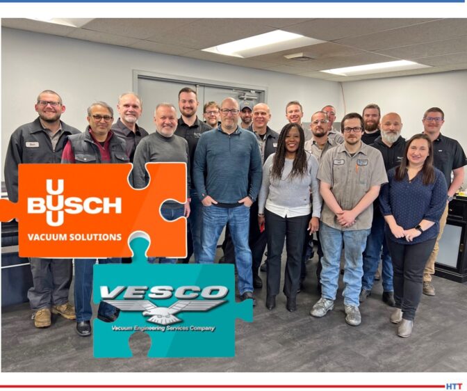 A group of people with the logos of the two companies in the foreground