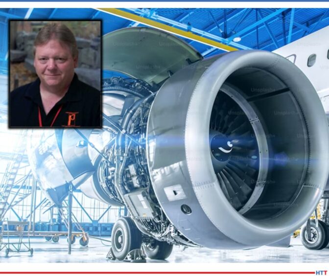 part of an airplane and the picture of a smiling man