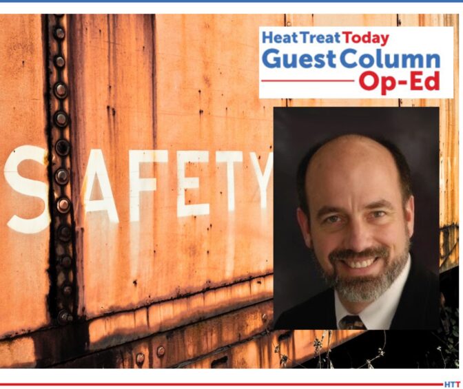 “Safety” in white paint on the side of a rusted, orange train car