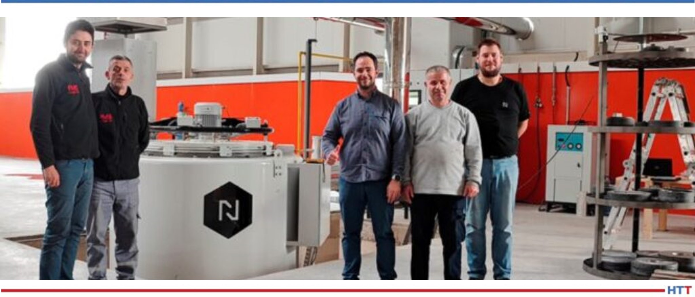 Five men in front of a Nitrex nitriding system