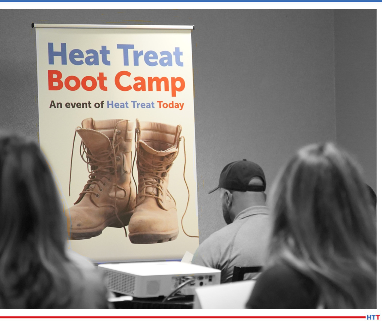 Group of people with Heat Treat Boot Camp sign 