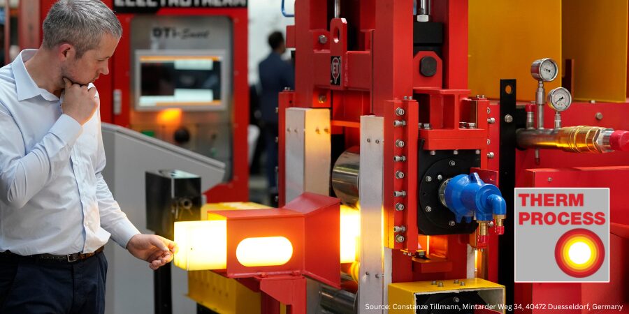 Man exploring electrotherm system with inset of THERMPROCESS logo